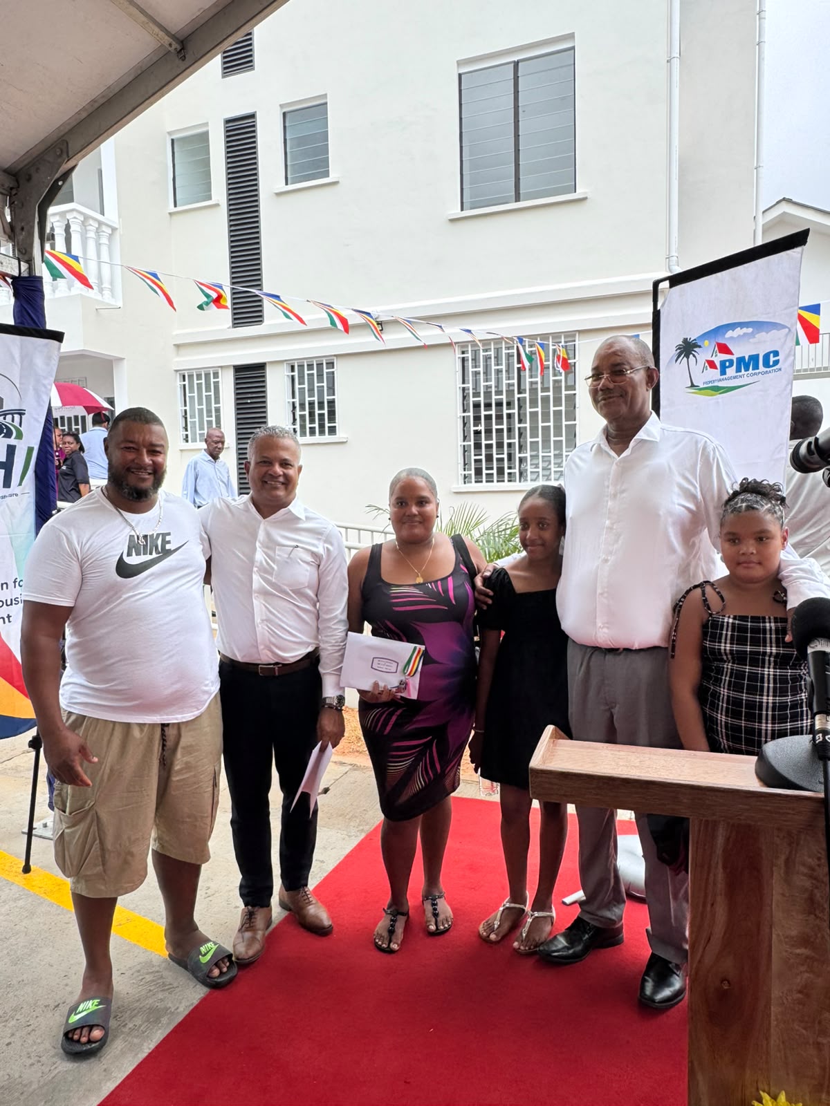 Sixteen families receive keys to new homes at Corgate Estate
