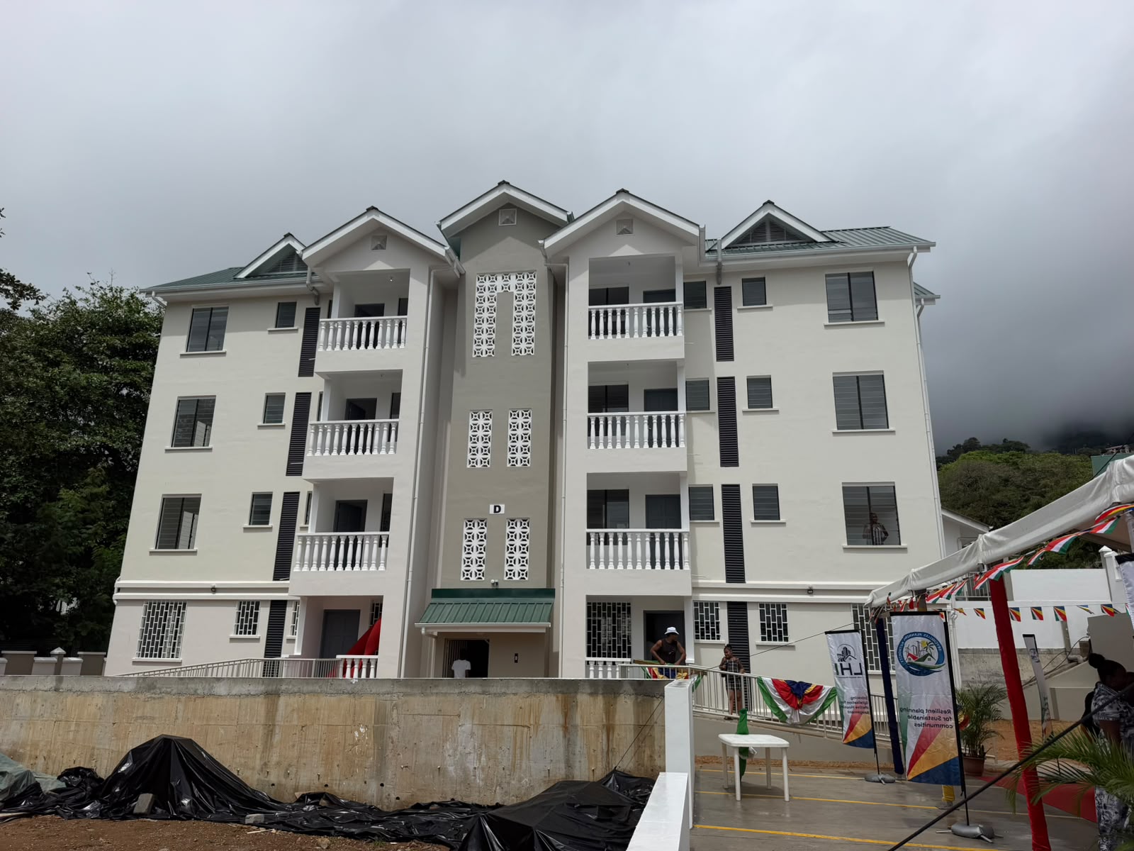 Sixteen families receive keys to new homes at Corgate Estate